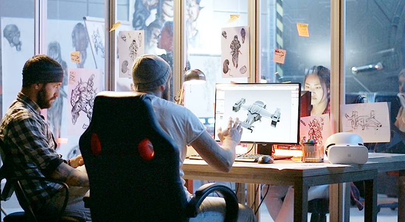 animators in front of a computer