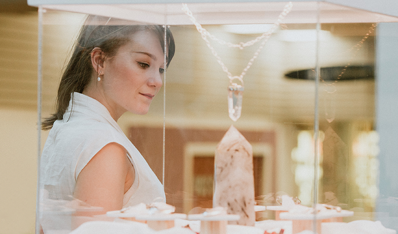Woman looking at jewellery display