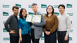 A group of students receiving an award
