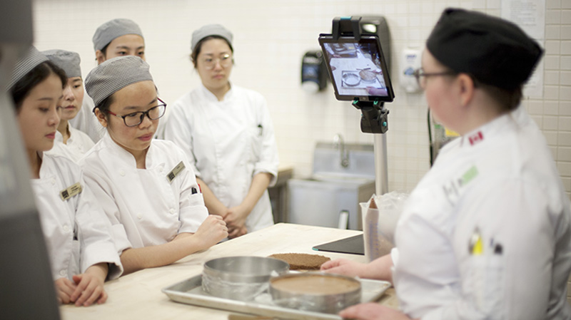 Baking students watching a demo