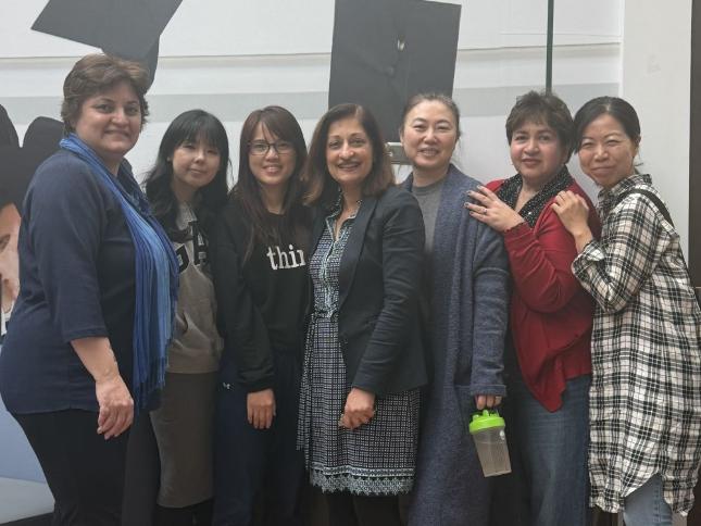 Happy students pose with a VCC staff member