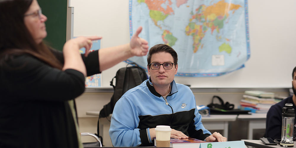 assisting student with a sign language interpreter