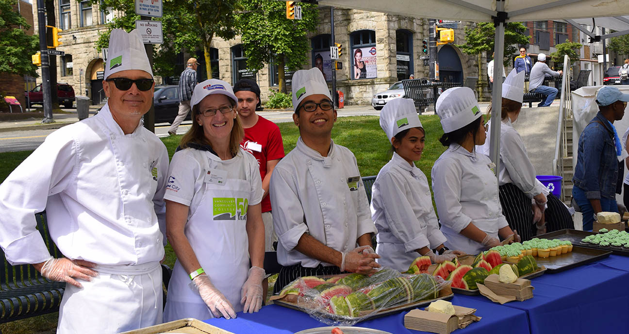 VCC culinary students and faculty serving food at the Fair in the Square event