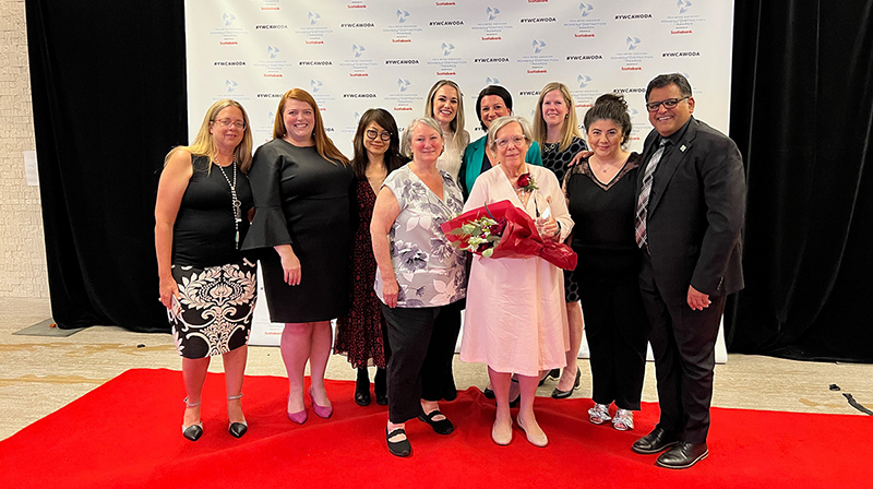 Libby Davies posing with VCC team for YWCA 2022 Awards