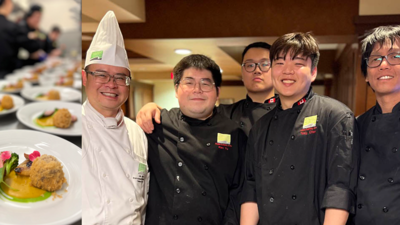 Plates of food laid out beside a group of asian culinary chefs and students