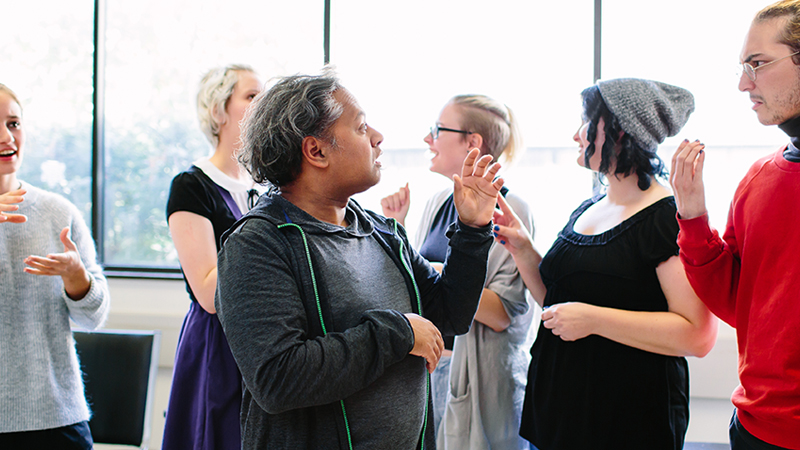 group of students communicating using sign language