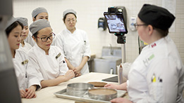 Baking students watching a demo