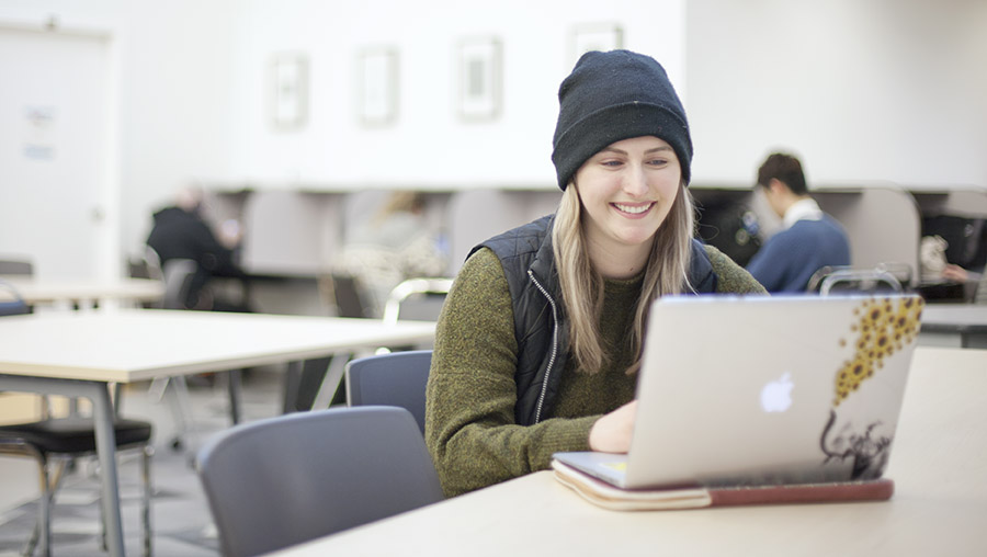 student using her laptop