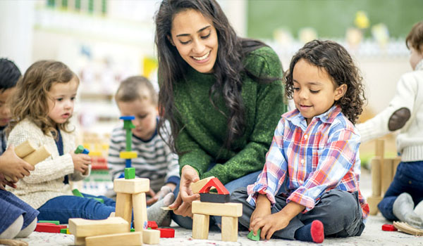 toddlers playing with blocks