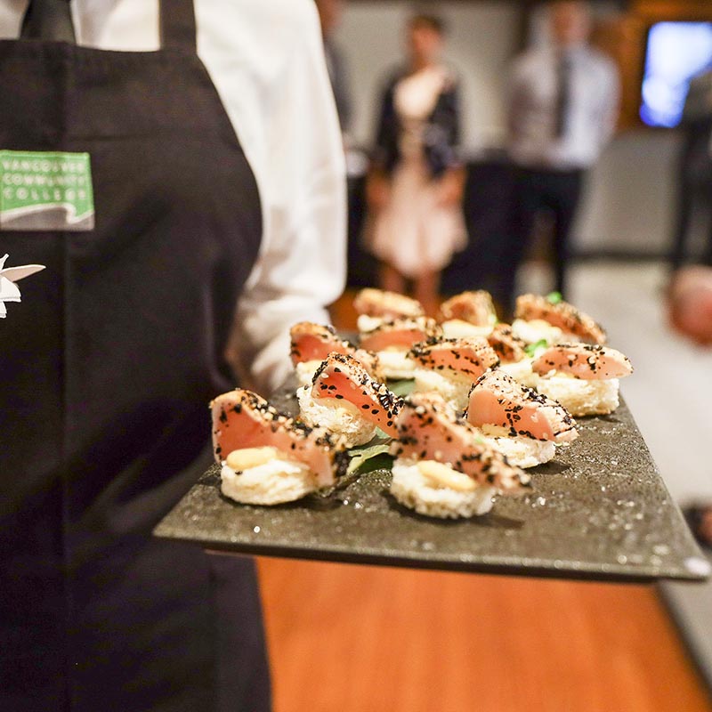 sushi being served by a server