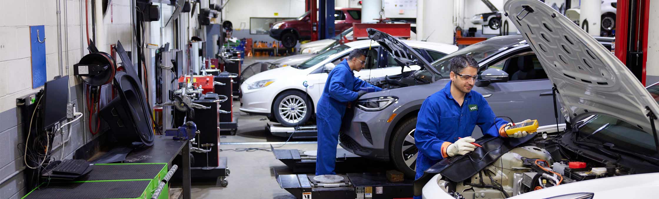 auto students fixing cars