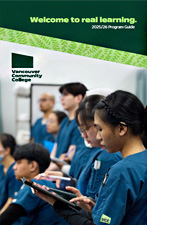 Dental student teaching a child how to brush teeth properly