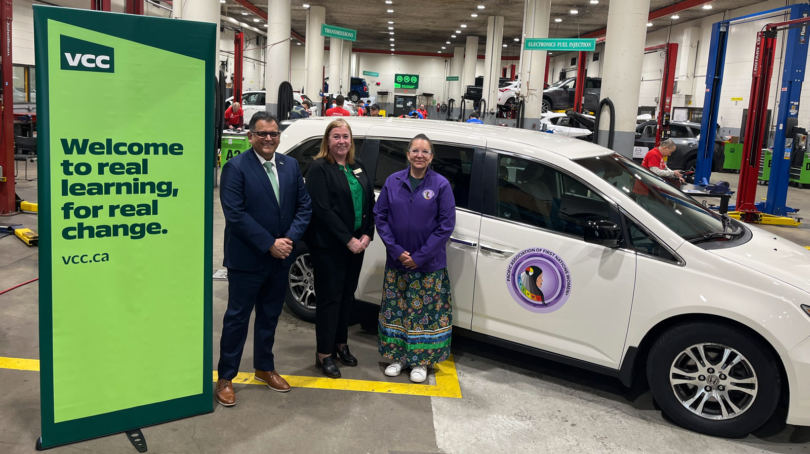 Sherri-Beth Rosette, Moira Gookstetter and Ajay Patel standing infront of the rebuilt van
